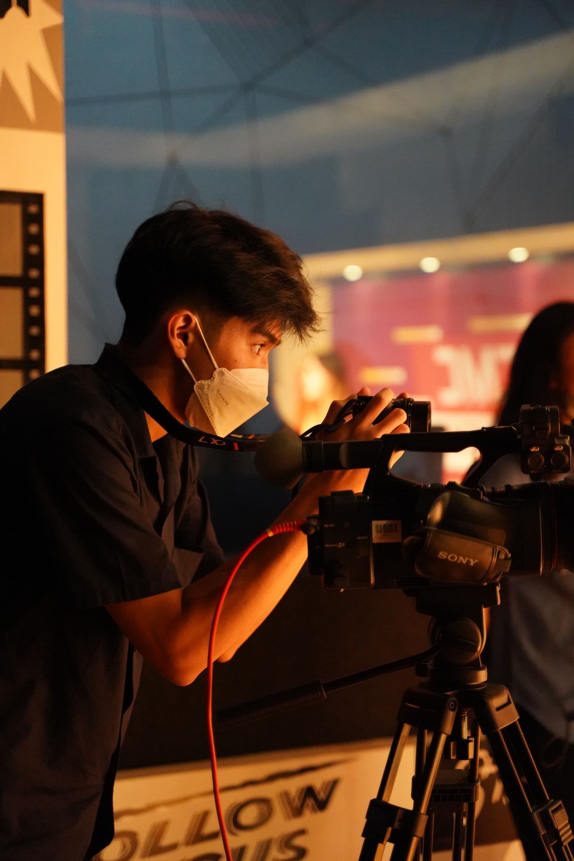 Filmmaker operating a video camera